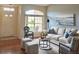 Comfortable living room featuring a neutral color palette, ample natural light, and stylish furniture at 18531 Bent Pine Dr, Hudson, FL 34667