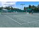 Well-maintained tennis court with lush green surroundings, offering a great recreational space at 18531 Bent Pine Dr, Hudson, FL 34667