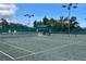 Scenic tennis court providing a perfect setting for recreational activities and sports enjoyment at 18531 Bent Pine Dr, Hudson, FL 34667