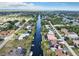 Scenic aerial view of a canal community with well-maintained homes and lush landscaping at 18702 Van Nuys Cir, Port Charlotte, FL 33948