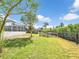 Spacious backyard with lush green grass and ample space for outdoor activities at 18702 Van Nuys Cir, Port Charlotte, FL 33948