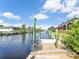 Scenic waterfront view from the private dock, offering access to the canal and tranquil water activities at 18702 Van Nuys Cir, Port Charlotte, FL 33948