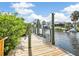 Private dock with a boat lift on the canal at 18702 Van Nuys Cir, Port Charlotte, FL 33948