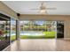 Sunroom with tile floors and glass sliding doors revealing a private pool and backyard at 18702 Van Nuys Cir, Port Charlotte, FL 33948