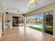 Sunroom with access to an outdoor living area with a hammock and a private pool at 18702 Van Nuys Cir, Port Charlotte, FL 33948