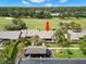 Aerial view of a home near a golf course, lush landscaping, and convenient parking at 190 Dale Pl, Oldsmar, FL 34677