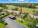 Aerial view of home and golf course, surrounded by lush landscaping at 190 Dale Pl, Oldsmar, FL 34677
