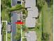 Bird's eye view of the home, carport, and street with lush surrounding at 190 Dale Pl, Oldsmar, FL 34677