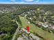Real estate featuring golf course views, mature trees, and well-manicured landscaping at 190 Dale Pl, Oldsmar, FL 34677
