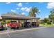 Exterior view showcasing carport parking, and landscaping at 190 Dale Pl, Oldsmar, FL 34677