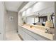 The kitchen features a long counter and cabinets with unique decorative items and view of the dining area at 190 Dale Pl, Oldsmar, FL 34677