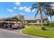 Scenic exterior view showcasing a well-maintained property with a carport and beautiful landscaping at 190 Dale Pl, Oldsmar, FL 34677
