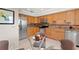 Well-lit kitchen features stainless appliances, granite countertops and wooden cabinets, offering storage space at 190 Dale Pl, Oldsmar, FL 34677