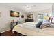 The main bedroom features a ceiling fan, a comfortable king bed, and access to a private lanai at 190 Dale Pl, Oldsmar, FL 34677