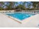 Community pool boasts crystal-clear water and lounge chairs for relaxation at 190 Dale Pl, Oldsmar, FL 34677