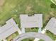 Overhead view of the home's roof, driveway, landscaping, and lawn within the community at 2214 Highclere Cir # 6, Sun City Center, FL 33573
