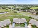 Aerial view of home at 2214 Highclere Cir Sun City Center, FL 33573 with golf course and ponds nearby at 2214 Highclere Cir # 6, Sun City Center, FL 33573