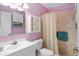 Bathroom featuring a shower, vanity, and mirrored medicine cabinet at 2214 Highclere Cir # 6, Sun City Center, FL 33573