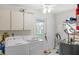 Laundry room featuring washer, dryer, and plenty of storage space at 2214 Highclere Cir # 6, Sun City Center, FL 33573