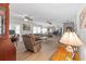Bright living room boasts hardwood floors, ceiling fans, and cozy furnishings at 2214 Highclere Cir # 6, Sun City Center, FL 33573