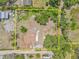 Aerial view of the property, showing the outline of the land, house, and surrounding greenery at 2233 Rightaway Ln, Plant City, FL 33565