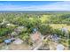 Aerial shot of the home situated among trees in a serene, rural setting at 2233 Rightaway Ln, Plant City, FL 33565
