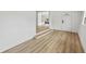 Entryway featuring modern hardwood flooring and white staircase at 2233 Rightaway Ln, Plant City, FL 33565