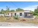 Inviting home featuring mature landscaping and a screened-in patio at 2233 Rightaway Ln, Plant City, FL 33565