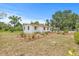 Quaint single-story home featuring a spacious yard with lush, decorative landscaping at 2233 Rightaway Ln, Plant City, FL 33565