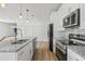 Bright, updated kitchen features granite counters and stainless steel appliances at 2233 Rightaway Ln, Plant City, FL 33565