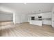 Bright, spacious kitchen with white cabinets, stainless steel appliances, and a large center island at 2233 Rightaway Ln, Plant City, FL 33565