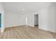 Spacious open living room with hardwood flooring and neutral walls at 2233 Rightaway Ln, Plant City, FL 33565