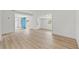 Spacious open living room with hardwood flooring and geometric accent wall at 2233 Rightaway Ln, Plant City, FL 33565