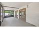 Sunroom boasts access to the backyard, wood paneling, and a screened exterior wall at 2233 Rightaway Ln, Plant City, FL 33565