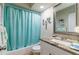 Clean bathroom featuring a granite countertop vanity, toilet, and a bathtub with a shower at 2238 Lark W Cir # D, Palm Harbor, FL 34684