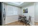Bright breakfast nook featuring tile floors, a breakfast table, and shutters at 2238 Lark W Cir # D, Palm Harbor, FL 34684