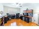 Spacious home office with built-in desk, storage, and natural light from shuttered windows at 2238 Lark W Cir # D, Palm Harbor, FL 34684