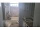 Practical bathroom features a bathtub, shower, vanity and neutral decor at 2603 Mary Sue Sw St, Largo, FL 33774