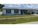 Charming single-story home with blue shutters and a well-maintained lawn at 2603 Mary Sue Sw St, Largo, FL 33774