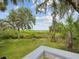 Private backyard with views of natural landscape and a tranquil lake at 2730 River Woods Dr, Parrish, FL 34219