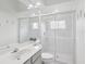 Well-lit bathroom with shower, toilet, vanity, and large mirror that amplifies the space at 2730 River Woods Dr, Parrish, FL 34219