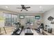Well-equipped community gym with modern exercise equipment and large windows for natural light at 2730 River Woods Dr, Parrish, FL 34219