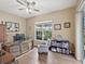 Home office showcasing hardwood floors, a decorative desk, and a serene view of the backyard at 2730 River Woods Dr, Parrish, FL 34219