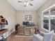 Spacious office features wood floors, neutral colors and a large window providing natural light at 2730 River Woods Dr, Parrish, FL 34219