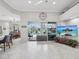 Bright living room featuring tile floors, and views of the pool and outdoor living area at 2730 River Woods Dr, Parrish, FL 34219