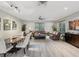 Spacious room featuring modern lighting, stylish furniture, and large windows for natural light at 2730 River Woods Dr, Parrish, FL 34219