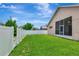Fenced-in backyard showing a meticulously manicured lawn and the back of the house at 30445 Tremont Dr, Wesley Chapel, FL 33543