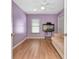Comfortable bedroom with wood laminate flooring, neutral walls, and a ceiling fan at 30445 Tremont Dr, Wesley Chapel, FL 33543