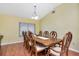 Elegant dining room with hardwood floors and ample natural light, perfect for hosting dinner parties and Gathering gatherings at 30445 Tremont Dr, Wesley Chapel, FL 33543