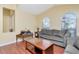 Comfortable living room with hardwood floors and large windows, ideal for relaxing and entertaining guests at 30445 Tremont Dr, Wesley Chapel, FL 33543